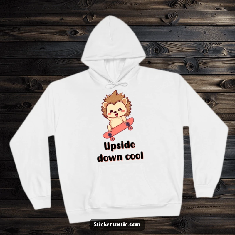 Funny Hedgehog Hoodie: A cozy hoodie featuring a happy hedgehog character performing an upside-down skateboard trick, blending comfort and humor.