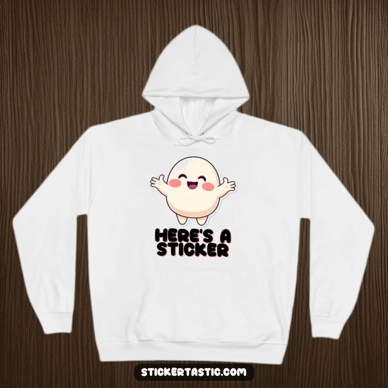 Funny blob hoodie depicting a smiling character offering a colorful sticker, providing a warm and cheerful addition to any wardrobe.