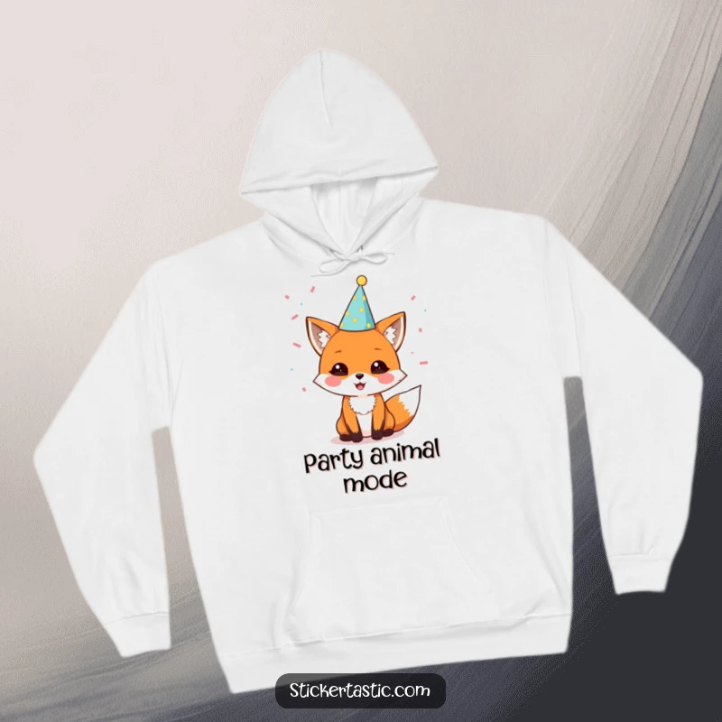 Funny hoodie with a delighted fox sporting a party hat amidst falling confetti, perfect for cozy celebrations and spreading happy vibes.