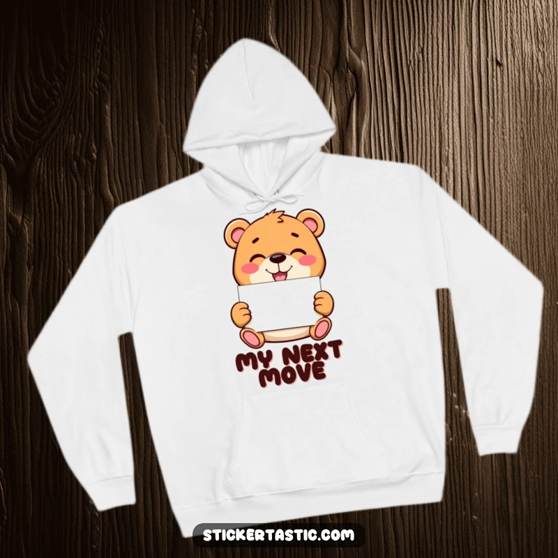 Funny bear hoodie depicting a mischievous character holding a blank sticker, offering a cozy and humorous base for personal expression and style.