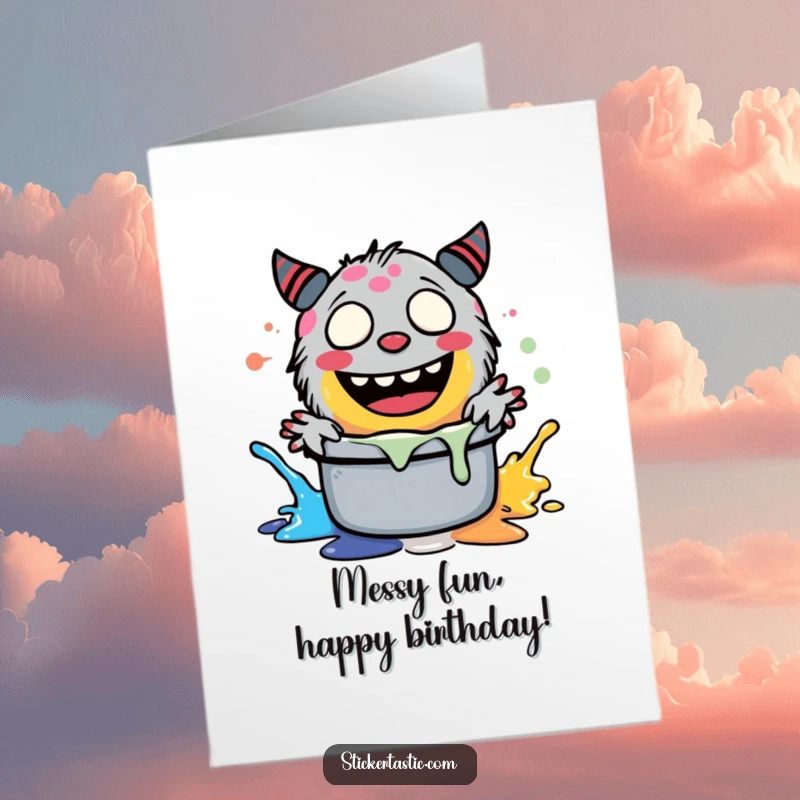 Funny free printable birthday card: A giggling green monster joyfully splashing blue paint in a pot, ready to celebrate.