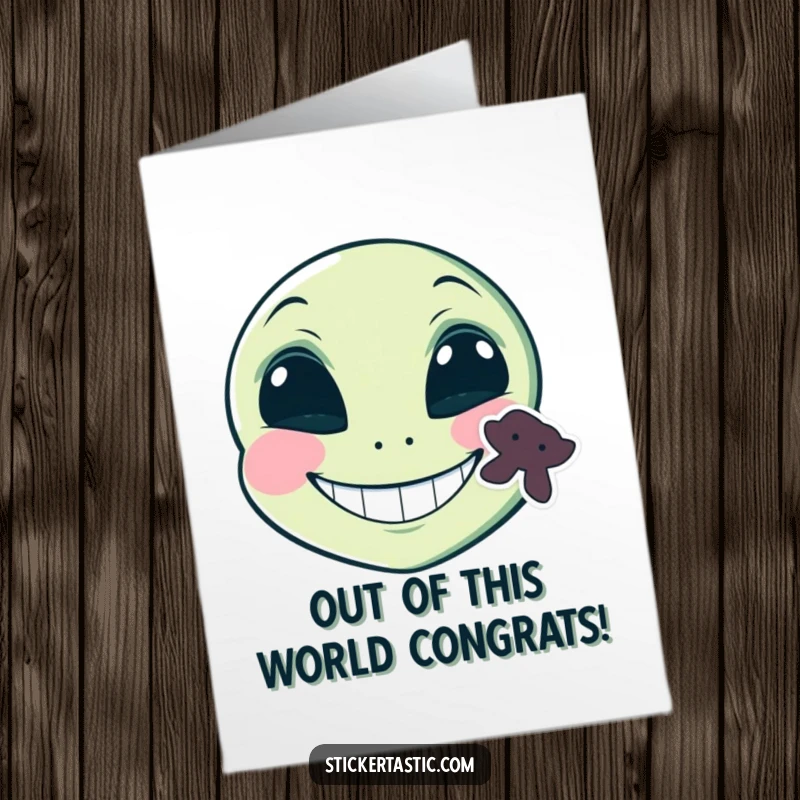 Funny Free Printable Alien Congratulations card featuring a grinning alien face with a sticker on its cheek, great for DIY gifts.
