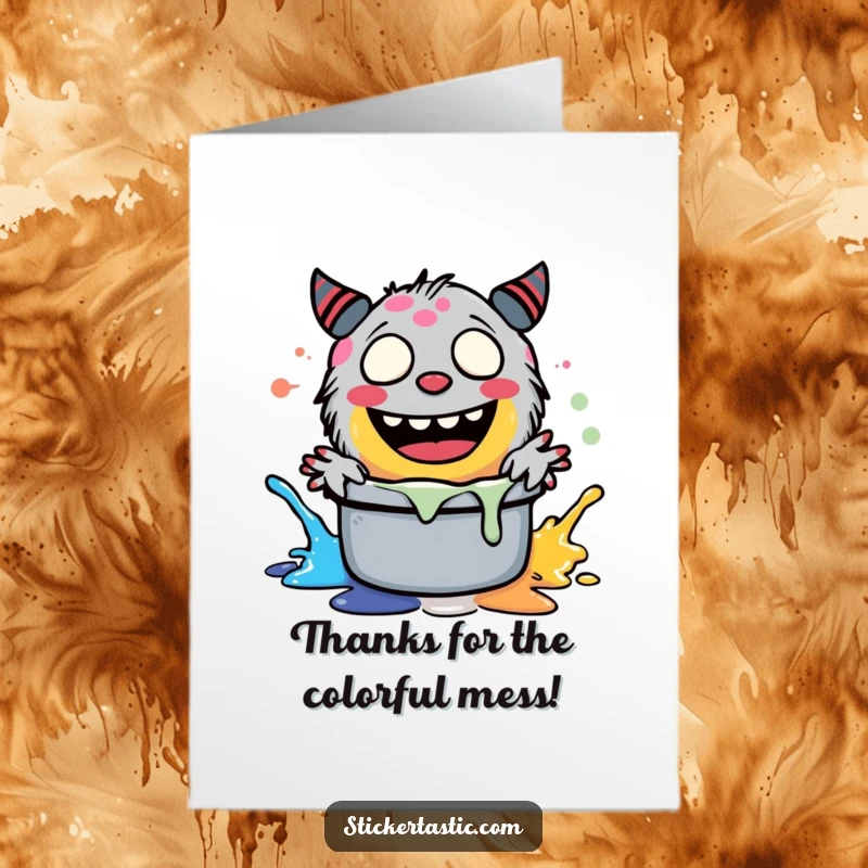 Funny free printable thank you card: A silly monster giggling while splashing vibrant paint, a unique way to express gratitude.