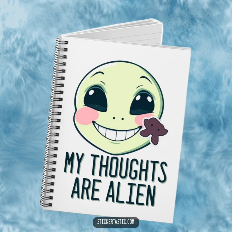 Funny grinning alien face with a sticker on its cheek notebook, a comical alien with a sticker and a smile, perfect for funny journaling.