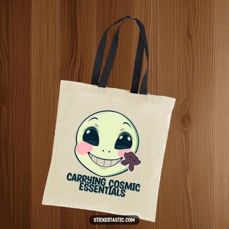 Funny grinning alien face with a sticker on its cheek tote bag, a comical alien with a grin and a sticker, ideal for funny, stylish carrying.